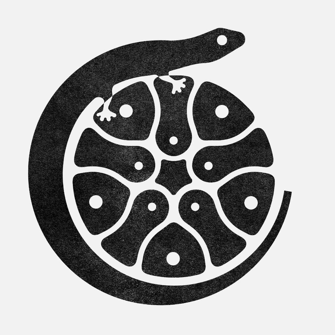 Emblema de Cactus Lagarto: un lagarto rodea un cactus.